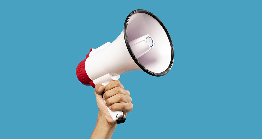 Picture of hand with mouthpiece on empty blue background